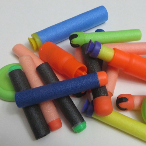 a collection of colorful nerf bullets