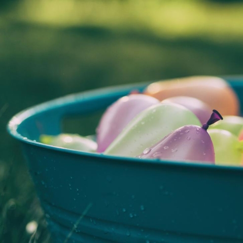 a tub filled with water balloons 