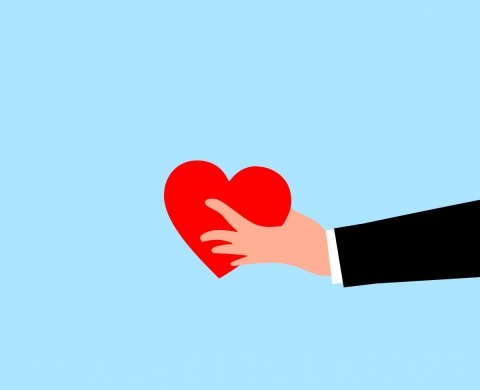 blue box with illustration of a hand holding out a heart